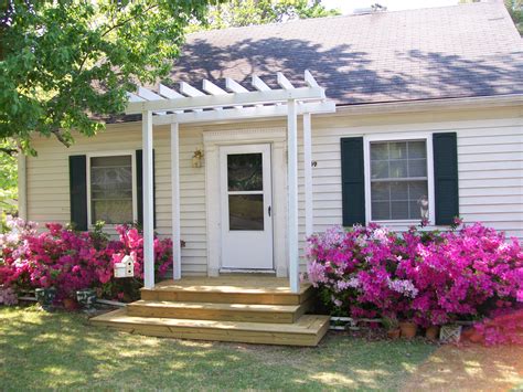 metal pergola in front of house|small pergola over front door.